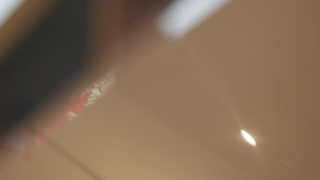  red Polish PRL emblem of white eagle without its crown hanging on white-gray wall. Old symbol of Poland. The Jack of the President of the Republic of Poland. High quality 4k footage