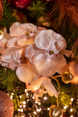 Christmas tree decorated is festivily decorated with vintage colorful balls, garlands and toys close up, Christmas background