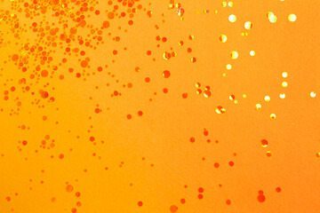 Shiny bright yellow glitter on beige background, flat lay