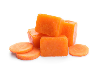 Fototapeta na wymiar Frozen carrot puree cubes and fresh carrot isolated on white