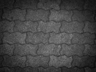 Rough brick floor background in dark gray color