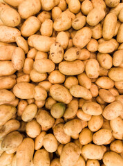 Fresh Potatoes in the supermarket. Vegetables and fruits exposed for the consumer to choose. Top view