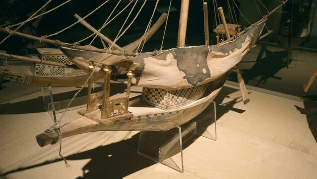 Wooden models of ancient Egyptian sailing and rowing boats found during excavations in Egypt. Shot in motion. Closeup