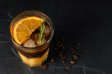 Tasty refreshing drink with coffee and orange juice on grey table, space for text