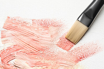 Beautiful strokes of colorful oil paints and brush on canvas, closeup