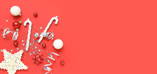 Fototapeta premium Composition with beautiful Christmas decorations on red background with space for text