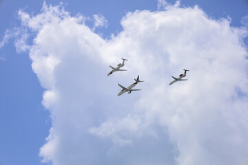 Modern airplanes flying in blue sky