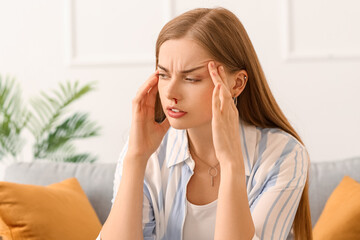Young woman with nosebleed at home, closeup
