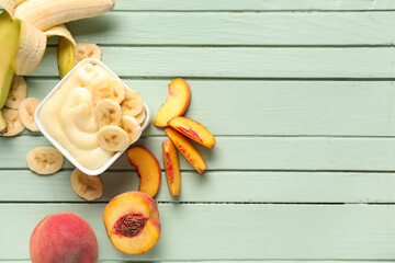 Composition with bowl of tasty vanilla pudding and fruits on color wooden background