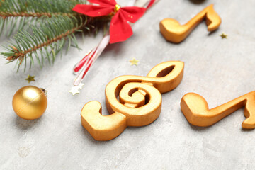 Note signs with Christmas ball on grunge background, closeup