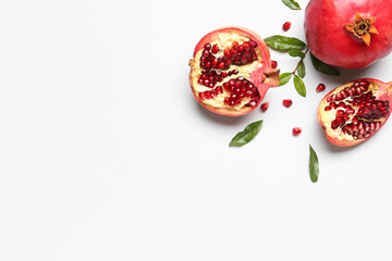 Composition with fresh ripe pomegranates on white background