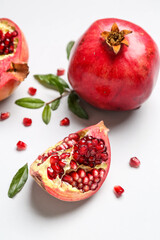 Fresh ripe pomegranates on white background