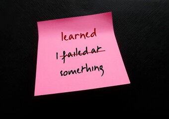 Pink note on black background with handwritten text I FAILED AT SOMETHING, changed to I LEARNED...