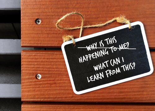 Chalboard with handwriting WHY IS THIS HAPPENING TO ME?, changed to WHAT CAN I LEARN FROM THIS? to overcome negative self talk or inner voice, change to positive thought to boost self esteem
