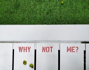 Bench in park with handwritten text inscription WHY NOT ME? (not WHY ME?) - overcome negativity by...