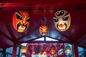 Japanese smiling Kabuki Noh mask lamp hang on red ceiling