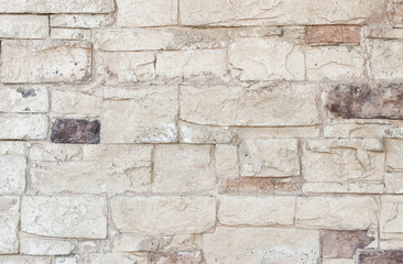 A close up background of white natural stone wall