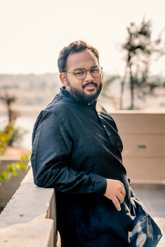 Middle age beard Indian Man posing for the camera