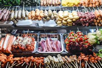 Many snacks and seafood in vietnamese night market in Da Lat