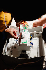 Electrician works cable checking energy