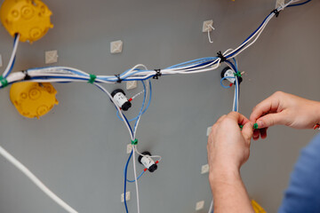 Electrician works cable checking energy