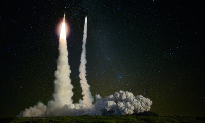 Two missiles launch at night. Escalation of the political situation. Elements of this image...