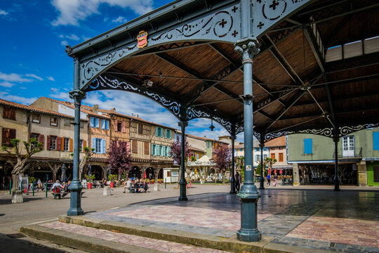 The covered market hall and the half timbered medieval houses on the main square of Mirepoix, in the South of France (Ariege)