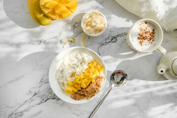 rice porridge with mango on coconut milk - obrazy, fototapety, plakaty