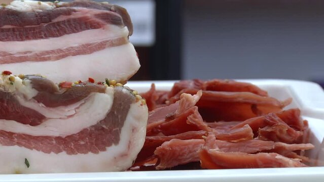 salted cooked pork belly on store counter