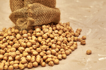 chickpeas in a canvas bag and scattered on the table