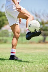 Football, soccer player and balance ball on foot on a grass field, sports pitch and a park ground....