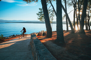 Cyclist on beach of Croatia, Island of Murter in Dalmatia