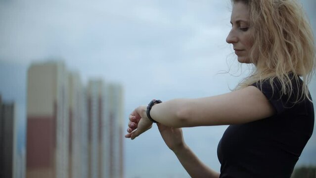 Heart Rate Smart Watch.Runner Checking Pulse On Smartwatch On Recreation Running Workout.Fit Woman Jogging Checking Pace On Smart Watch.Runner Using Smart Band.Run Girl Check Pulse On Fitness Bracelet