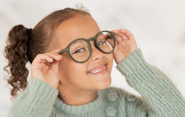 Face portrait, child and girl with glasses for optical health at optometrist office. Eyes wellness,...