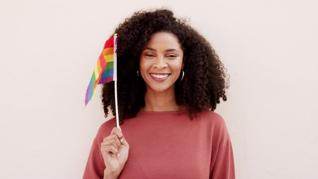 Lgbt, rainbow and black woman with a flag for support to the gay, lgbtq, queer and lesbian community. Portrait of happy girl protesting for transgender rights, gender fluid or sexuality with pride