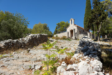 A little church at the end of an old wide stairway made of stone in Hvar, Croatia. The name of the church is "Church of Our Lady of the Rosary".