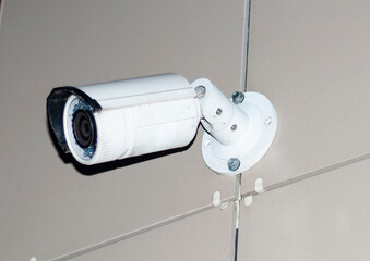 outdoor surveillance cameras on the facade of the house.
