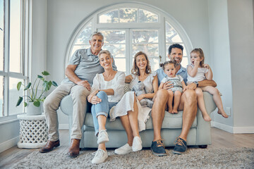 Family, children and grandparents with a man, woman and grandkids sitting on a sofa in the home...
