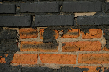 Brick background. Black and orange.
