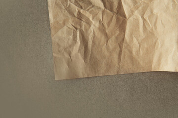 Creased Craft light brown color recyclable organic folded paper bag texture on solid brown...