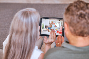 Senior couple tablet, video call happy birthday to children and communication app on living room sofa. Elderly man, woman and digital mobile technology for internet video conference to congrats kids
