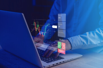 Buy and Sell. Stock chart or cryptocurrency chart with businessman hand typing notebook (Laptop)....