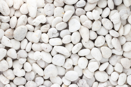 White pebbles stone or river stone  texture and background