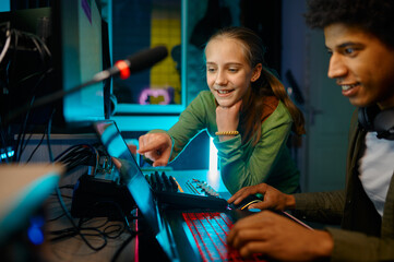 Sound producer mixing track with a child