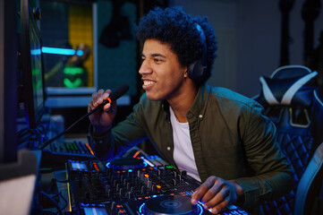 Radio host speaking into microphone