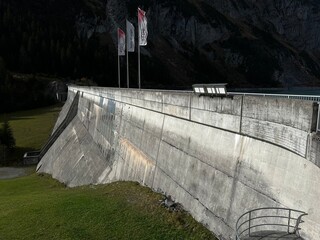 The dam Panixer or concrete dam on the reservoir lake Panixersee (Lag da Pigniu) on the slopes of...