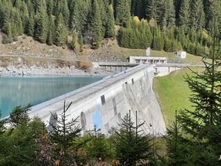 The dam Panixer or concrete dam on the reservoir lake Panixersee (Lag da Pigniu) on the slopes of...