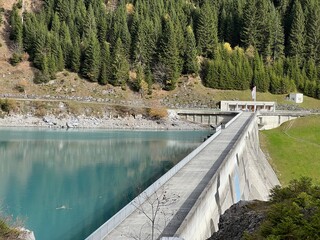 The dam Panixer or concrete dam on the reservoir lake Panixersee (Lag da Pigniu) on the slopes of...