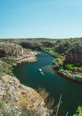 Beautiful view of maguk gorge lake with green cliffs in Kakadu, Australia on a sunny day