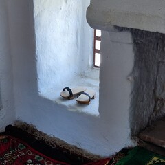 Pair of wooden Bosnian old shoes in the mosque
